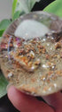 Zenify™ Phantom Quartz Sphere showing layered interior and natural phantom formations, perfect for mindful collectors.