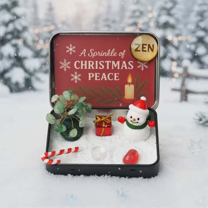 Zenify™ Christmas Zen Pocket Garden — a festive mini Zen set with a green aventurine tree, snowman, gift box, candy cane, and healing crystals on white sand.