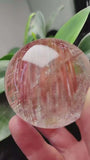 Zenify™ Rutilated Quartz Crystal Sphere showing golden threads, perfect for meditation and home decor.