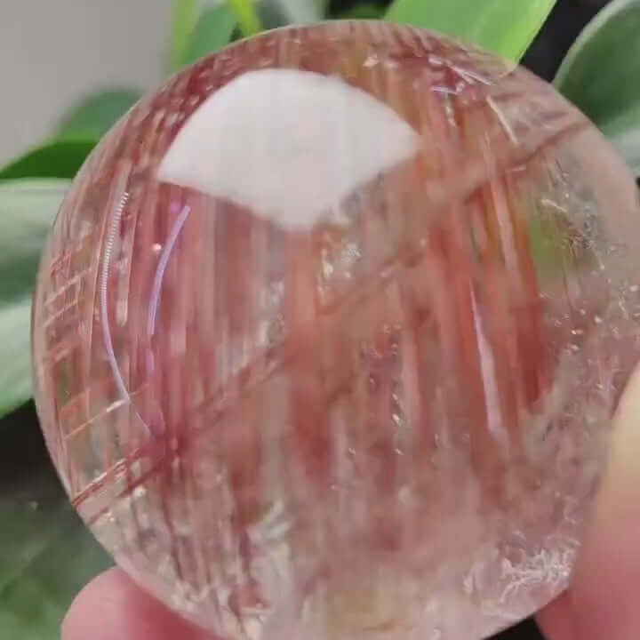 Zenify™ Rutilated Quartz Crystal Sphere showing golden threads, perfect for meditation and home decor.