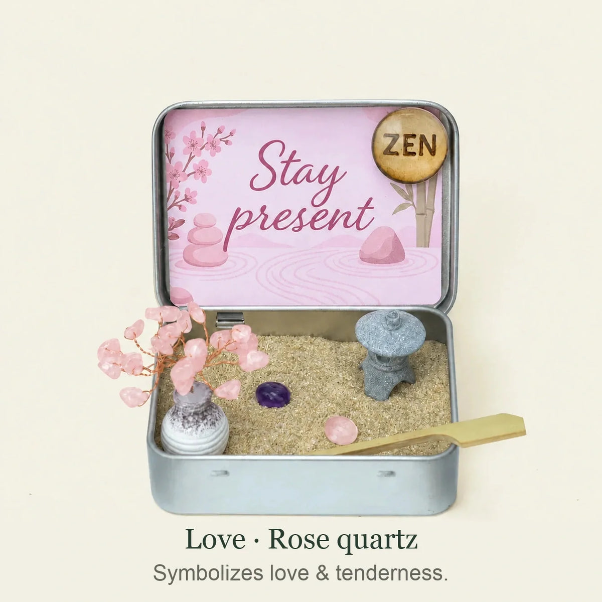 Love edition Japanese Crystal Zen Garden with rose quartz tree, two stones, lantern and sand. Caption: Symbolizes love & tenderness.