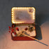 12-Zodiac Crystal Zen Garden with mini figurines and decorative elements in a lit tin container.