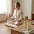 Portable Chakra Aromatherapy Mist for Yoga & Deep Meditation - 10ml with a woman meditating in a serene environment.