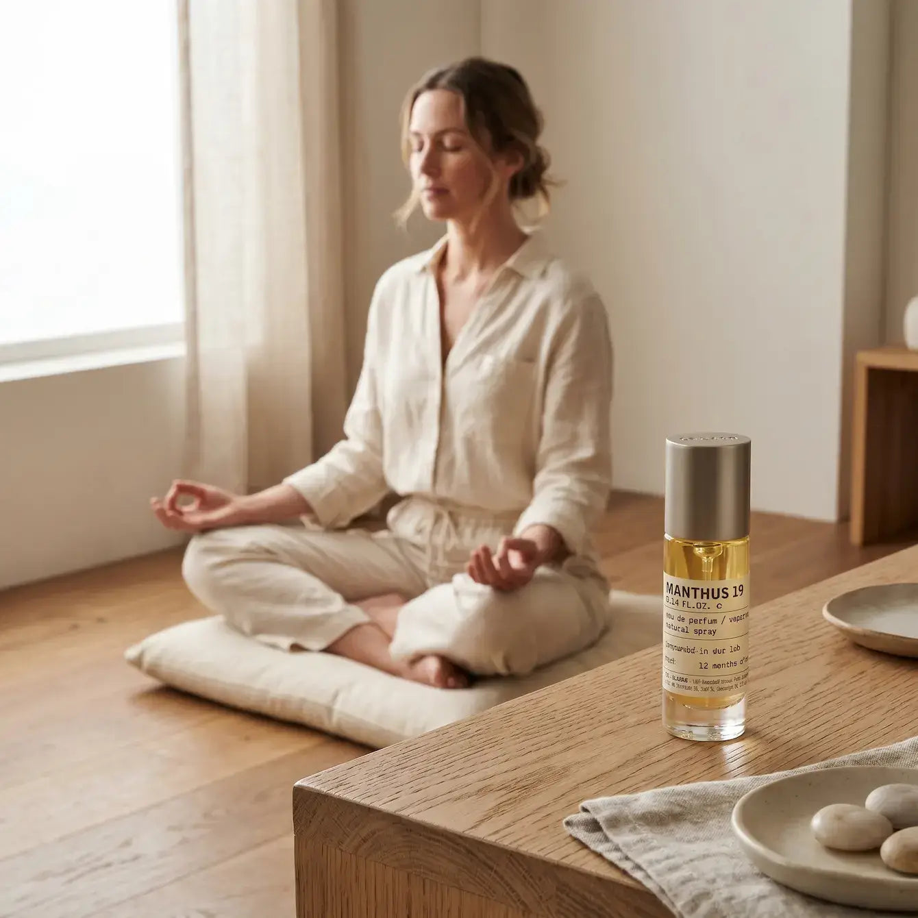 Portable Chakra Aromatherapy Mist for Yoga & Deep Meditation - 10ml with a woman meditating in a serene environment.